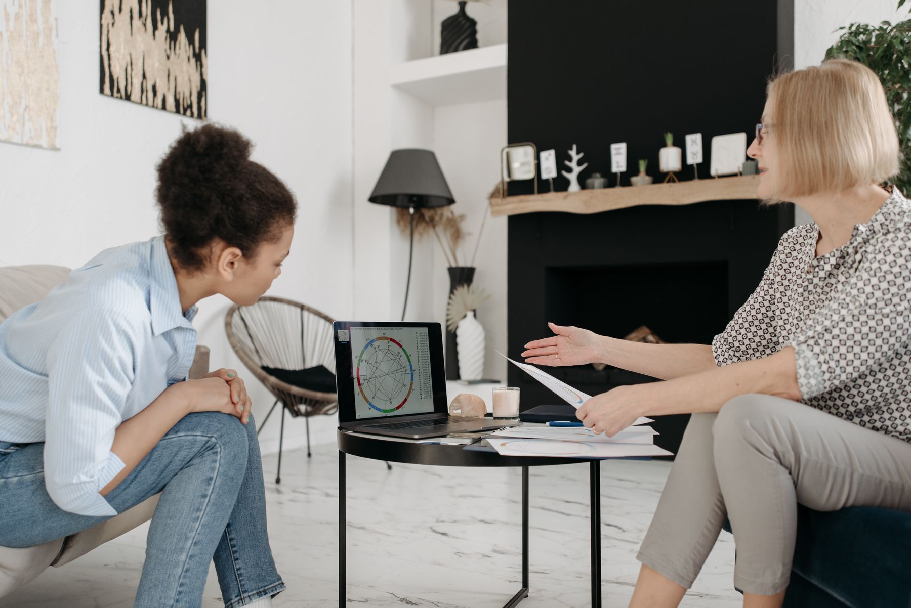 Astrologer explaining a natal chart during a personal consultation