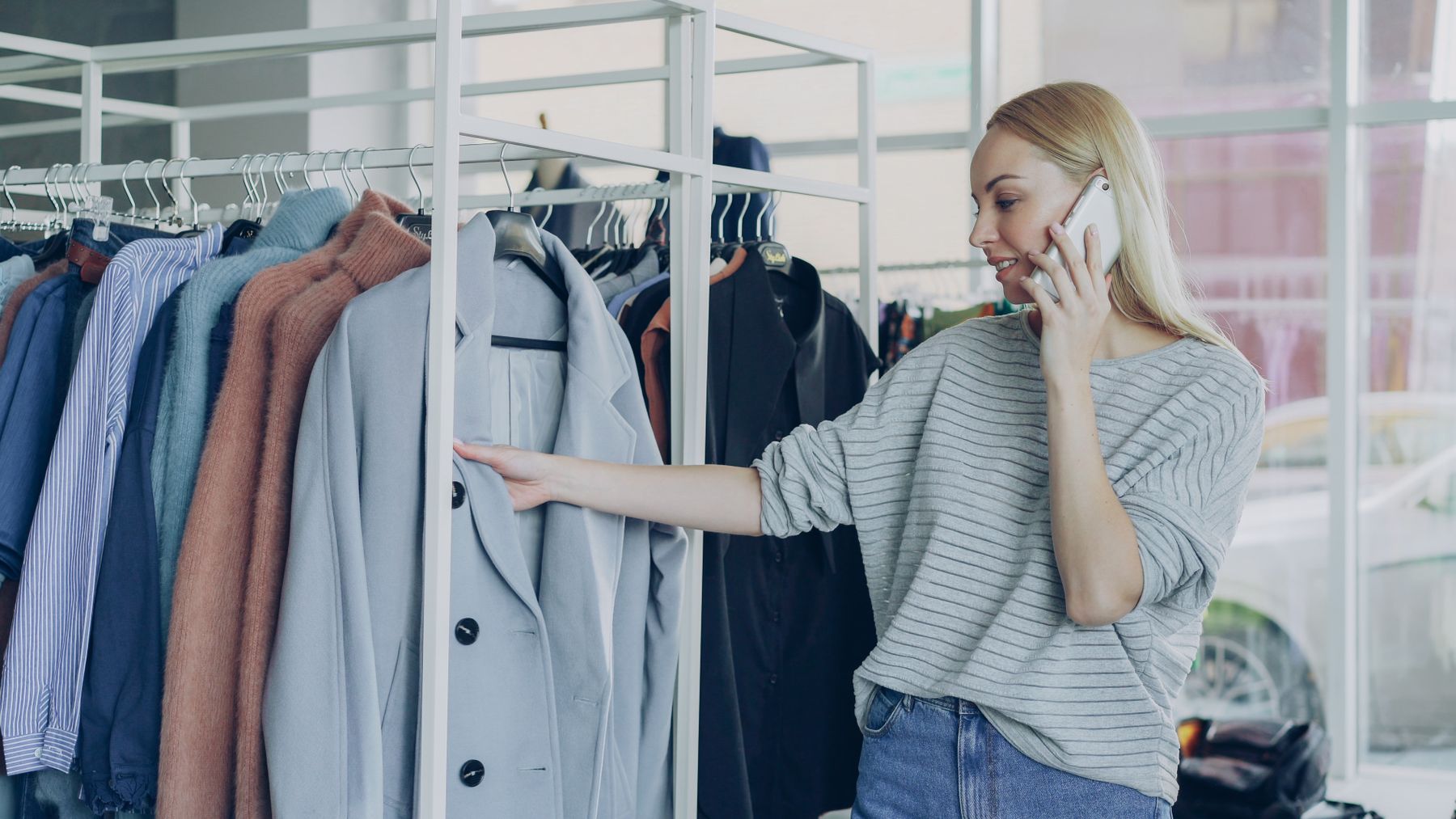 Fashion creator shopping for clothes while using a smartphone