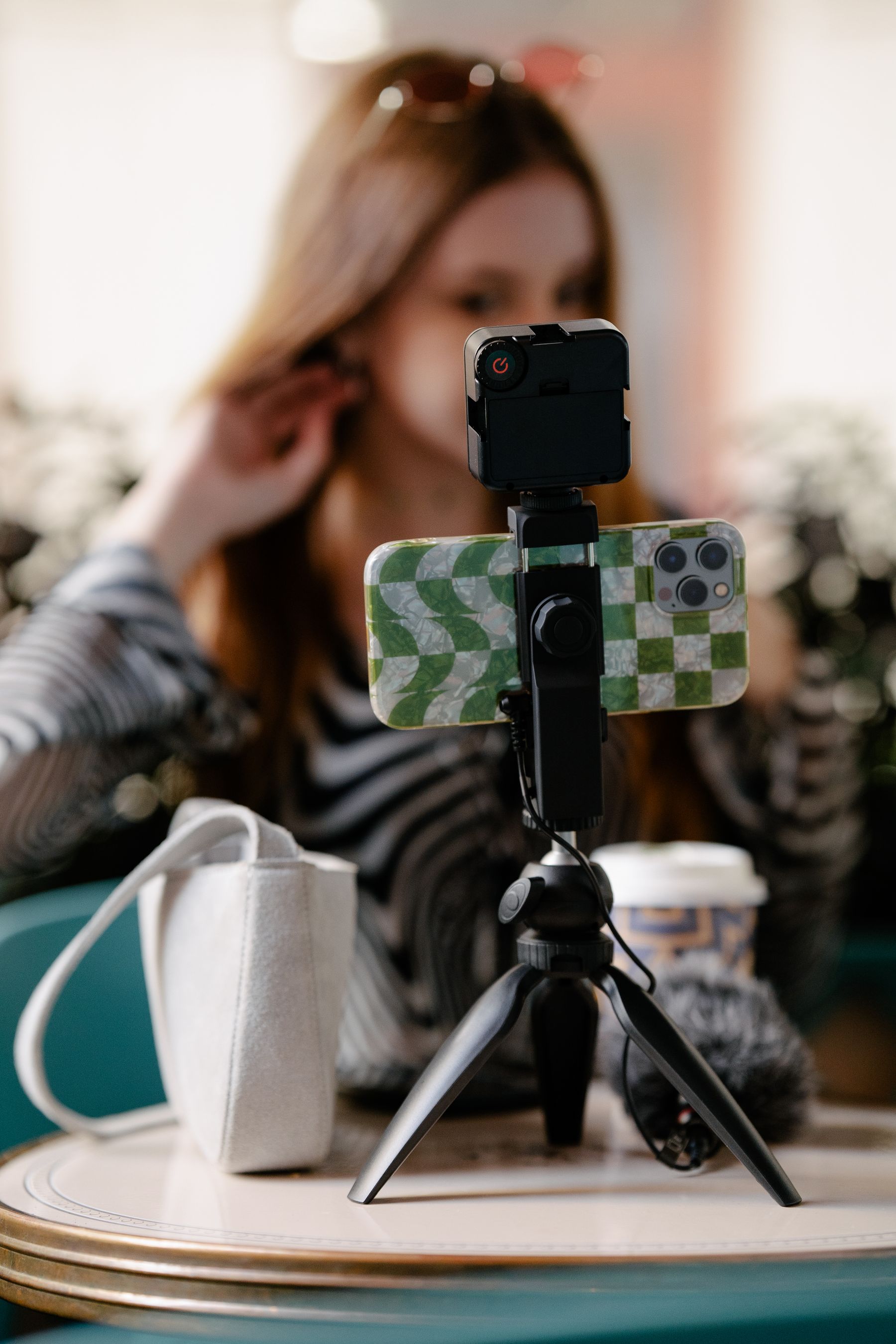 Micro-influencer recording social content with a smartphone