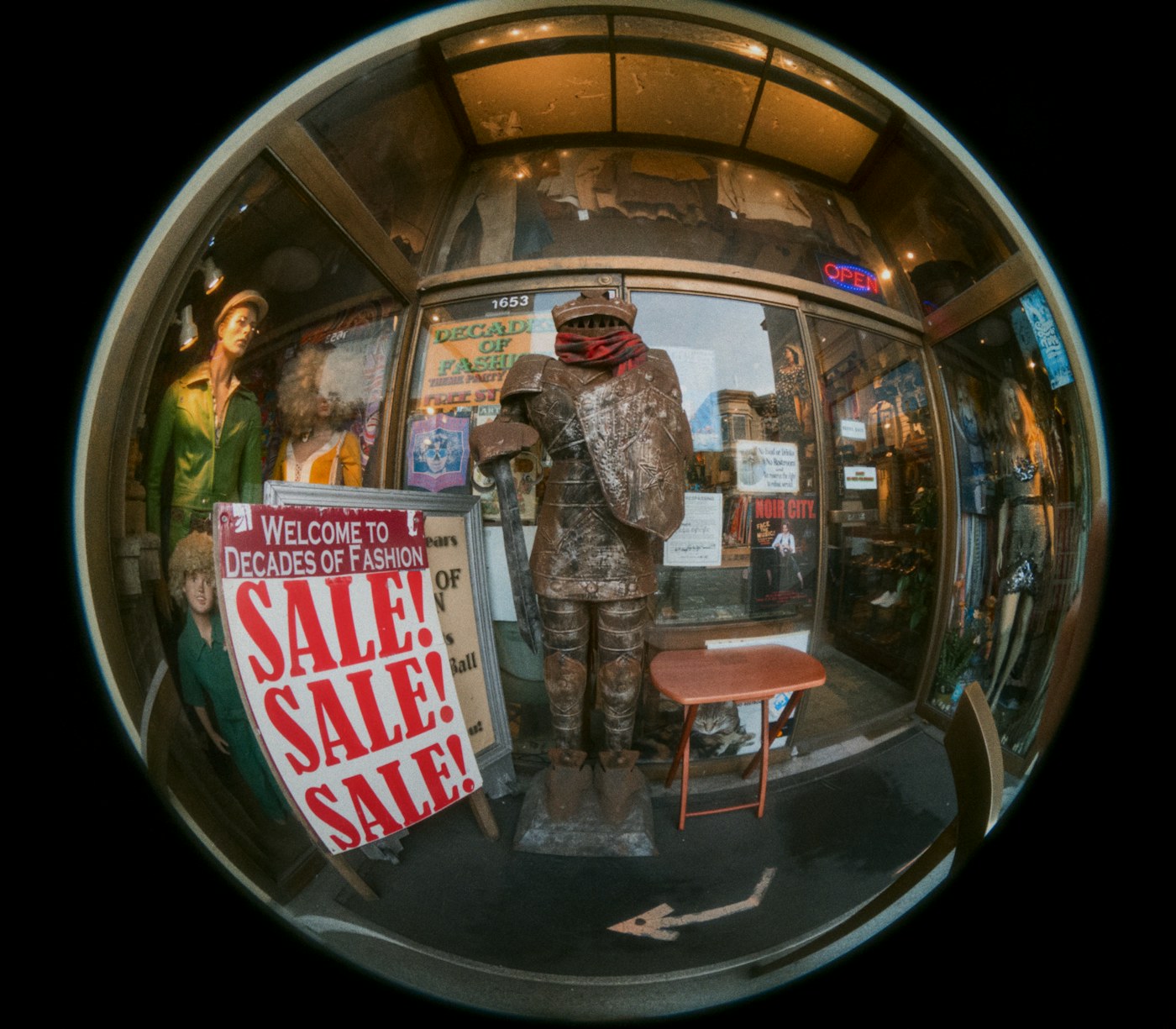 Suit of armor displayed outside a vintage clothing store