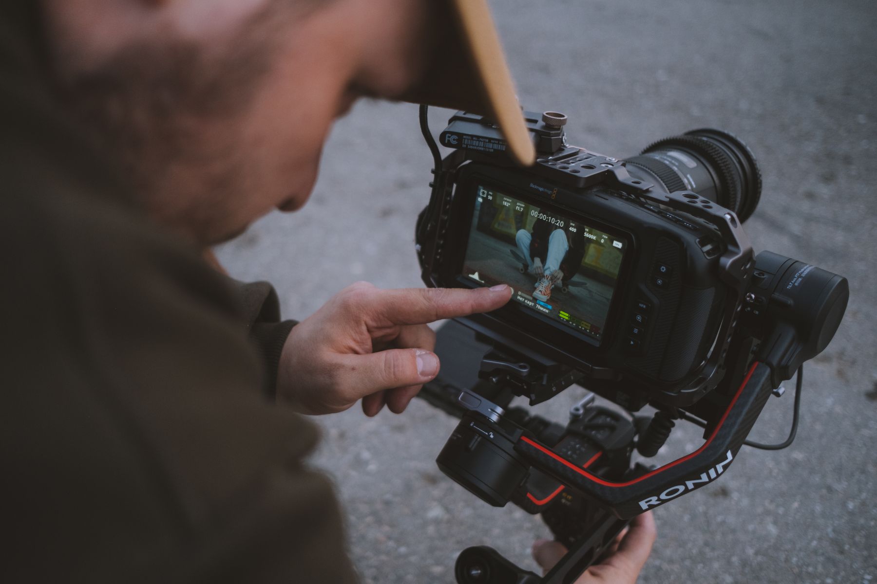 Technology creator reviewing footage on a professional camera