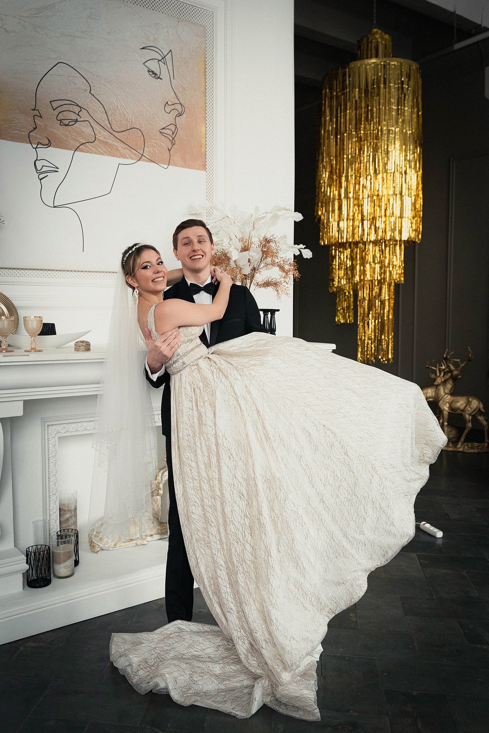 Bride and groom celebrating at a decorated wedding venue