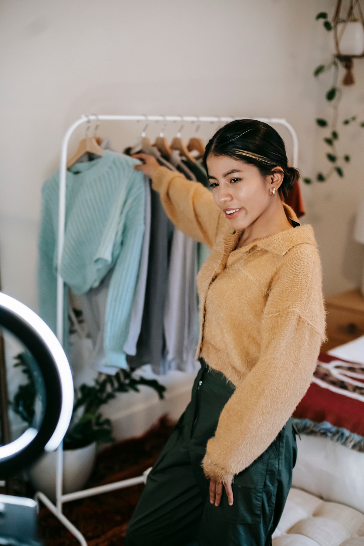 Fashion creator presenting clothing for an online audience