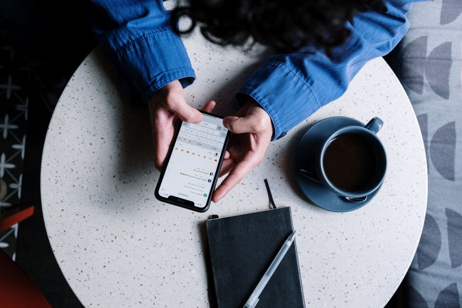 Subscription content creator managing messages on a phone